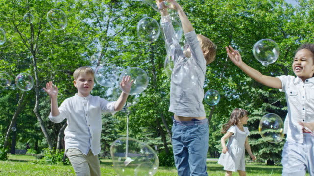 Cheerful-Kids-Chasing-Soap-Bubbles