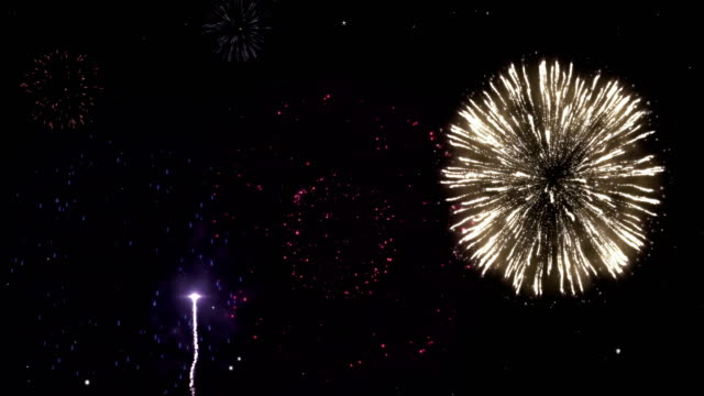 Celebración-de-fondo-de-fuegos-artificiales-fuegos-artificiales-partículas-nocturno-cielo-moción-de-felicitación.
