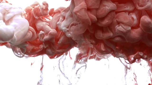 Red-and-white-acrylic-paint-cloud-spraying-in-water-on-white-background.