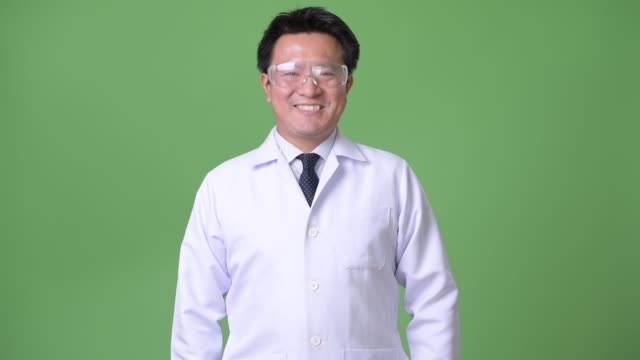Mature-Japanese-man-doctor-wearing-protective-glasses