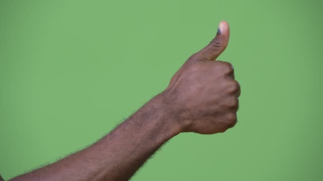 Hand-of-young-African-man-giving-thumbs-up