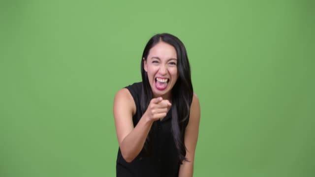 Young-beautiful-Asian-businesswoman-laughing