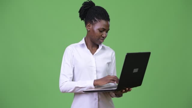 Young-beautiful-African-businesswoman-using-laptop