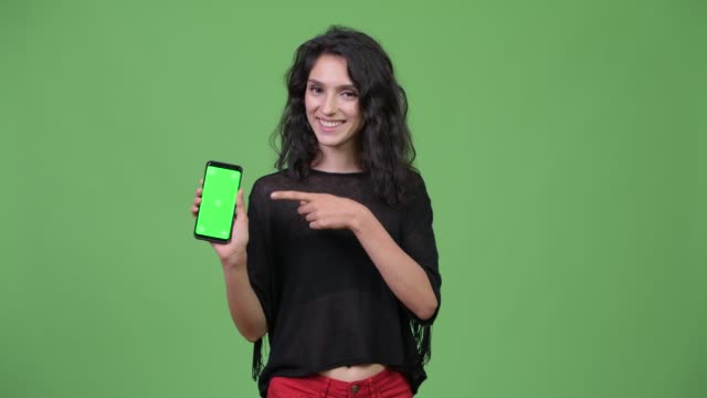 Young-beautiful-woman-showing-phone