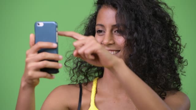 Young-beautiful-Hispanic-woman-using-phone