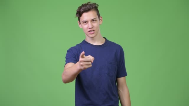 Young-angry-teenage-boy-talking-to-camera