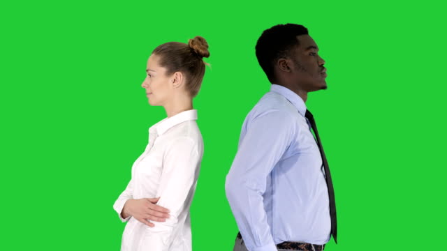 Beautiful-and-handsome-guy-standing-back-to-back-changing-poses-on-a-Green-Screen,-Chroma-Key