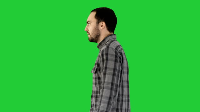 Confident-successful-smart-casual-businessman-walking-on-a-Green-Screen,-Chroma-Key