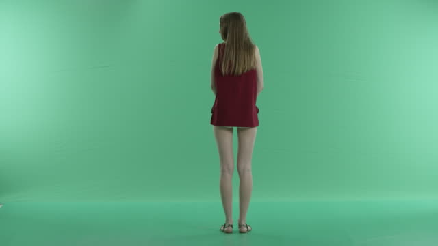 beautiful-girl-waiting-for-someone-on-a-green-screen