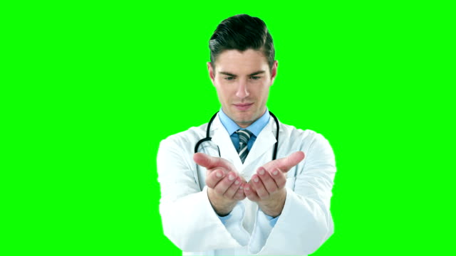 Doctor-pretending-to-hold-a-invisible-object