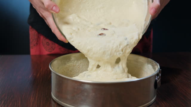Cook-Placing-Cheese-Dough-in-a-Baking-Pan