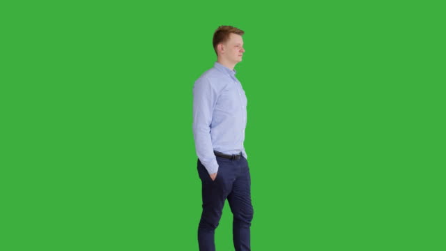 Young-Caucasian-Man-Standing-against-Green-Screen-Background.-Male-Person-Isolated-on-Chroma-Key.-Casual-Business-Professional-Portrait