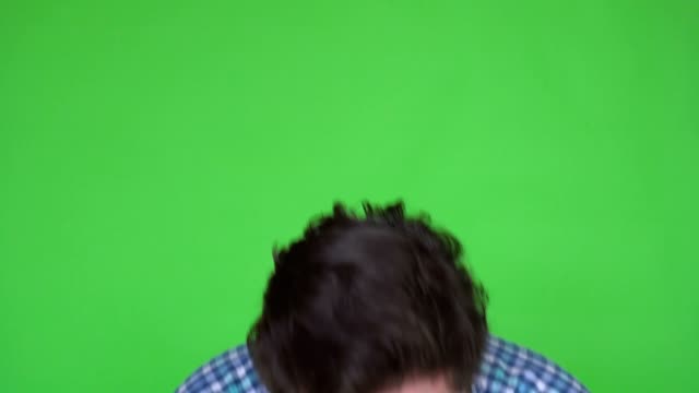Close-up-Shot-of-a-Sick-Man-in-Plaid-Shirt-Caughing-and-Sneezing.-Background-is-Green-Screen.