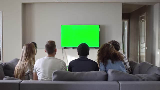 Group-of-Friends-Watching-Soccer-on-Chroma-Key-TV-at-Home