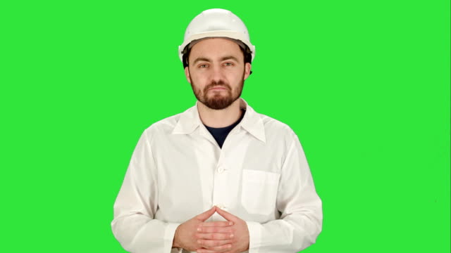 Engineer-or-architect-showing-like-gesture-on-a-Green-Screen,-Chroma-Key
