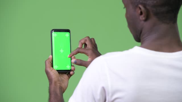 Young-African-man-using-phone