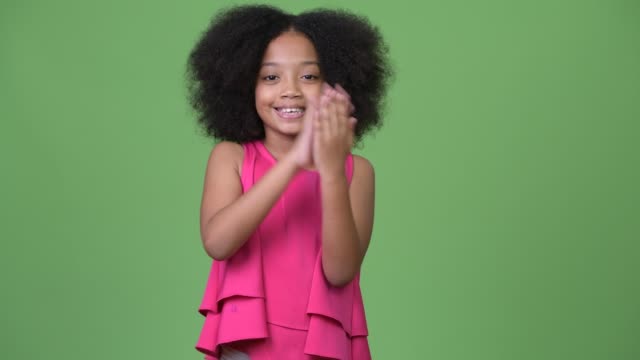 Young-happy-African-girl-with-Afro-hair-clapping-hands