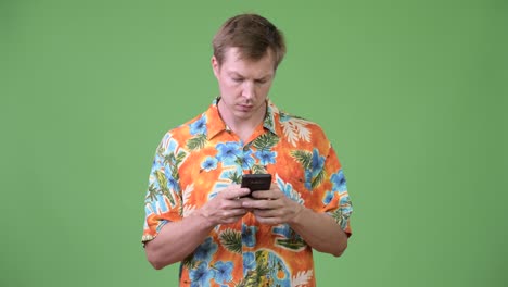 Young-handsome-tourist-man-using-phone