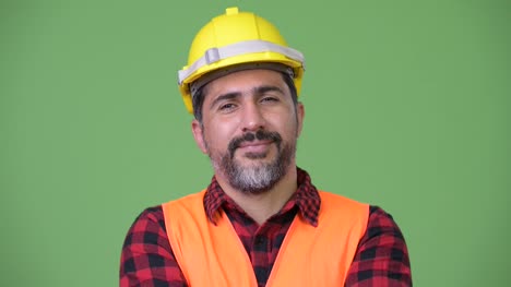 Hübscher-persische-bärtigen-Mann-Bauarbeiter-lächelnd
