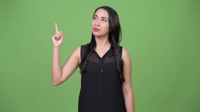 Young-beautiful-Asian-businesswoman-pointing-finger-up