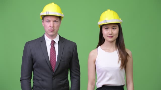 Multi-ethnic-business-couple-as-engineers-together