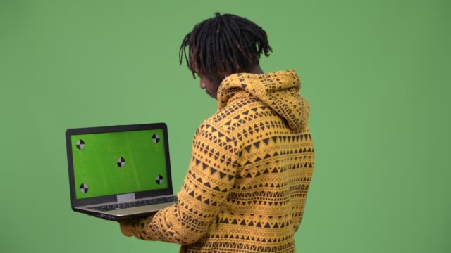 Young-handsome-African-man-using-laptop
