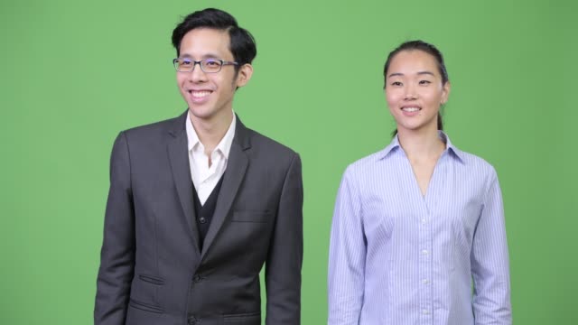 Young-happy-Asian-business-couple-together