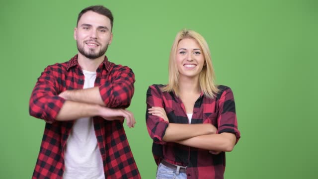 Young-couple-with-arms-crossed-together