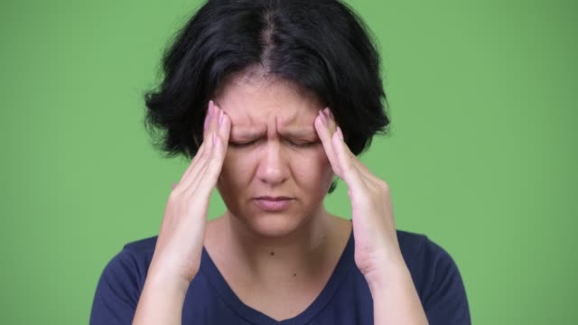 Stressed-woman-with-short-hair-having-headache