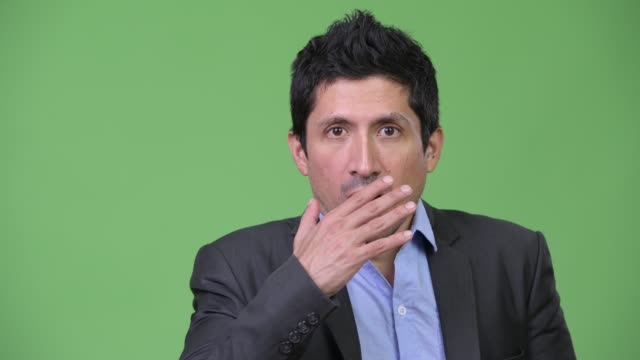 Hispanic-businessman-looking-shocked