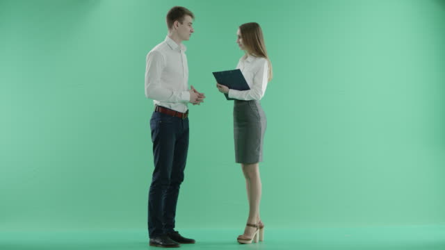 colleagues-talking-on-a-green-screen
