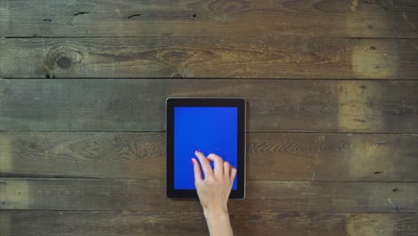 Zoom-In-Hand-Digital-Tablet-with-Blue-Screen