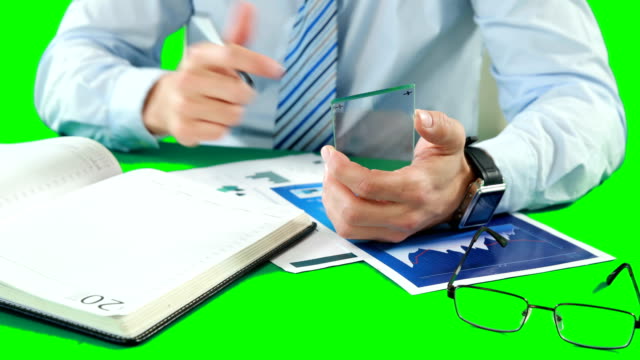 Businessman-using-digital-smartphone-while-working