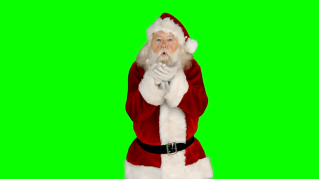Portrait-of-santa-claus-giving-flying-kiss