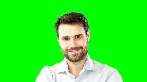 Smiling-man-standing-against-green-screen