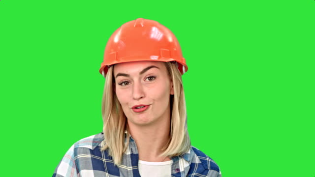 Construction-worker-talking-to-camera-on-a-Green-Screen,-Chroma-Key