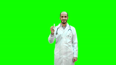 Young-doctor-presenting-brand-new-medicine-on-a-Green-Screen,-Chroma-Key