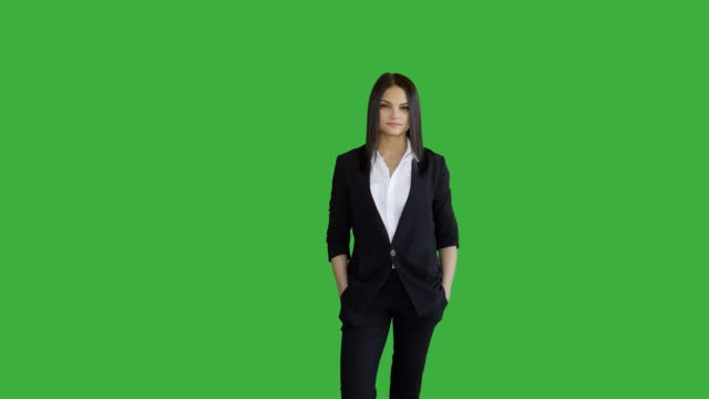 Young-Attractive-Brunette-Women-Standing-Isolated-Against-Green-Screen-Background.-Portrait-of-Beautiful-Professional-Female-Person-in-Suit