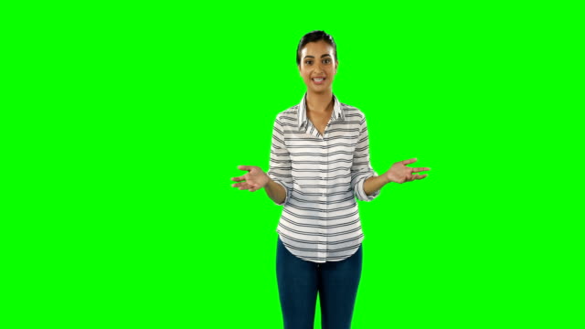 Woman-giving-a-presentation-against-green-screen-4k