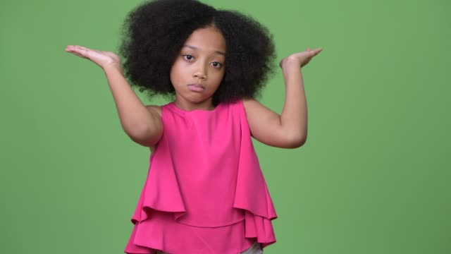 Young-cute-African-girl-with-Afro-hair-shrugging-shoulders