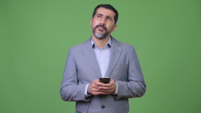 Handsome-Persian-bearded-businessman-using-phone