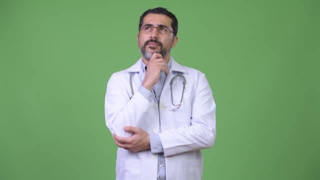 Handsome-Persian-bearded-man-doctor-thinking