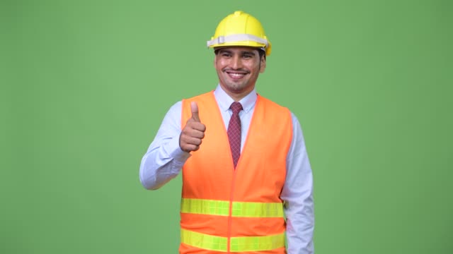 Schönen-jungen-persischen-Mann-Bauarbeiter-Daumen-aufgeben
