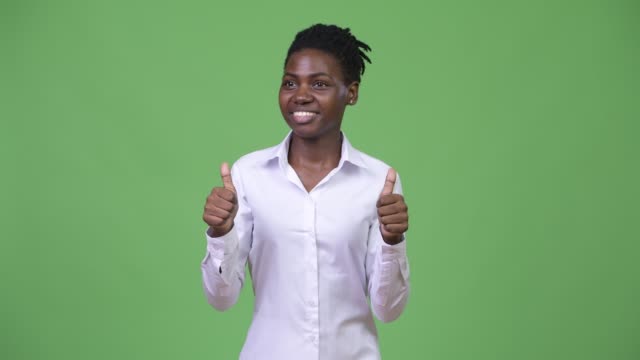 Young-beautiful-African-businesswoman-giving-thumbs-up