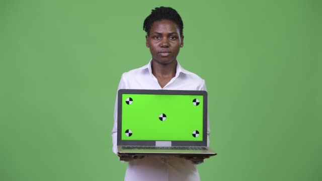 Young-beautiful-African-businesswoman-showing-laptop