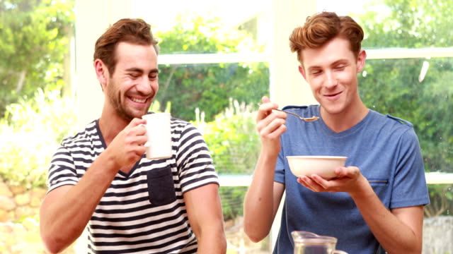Happy-homosexual-taking-breakfast