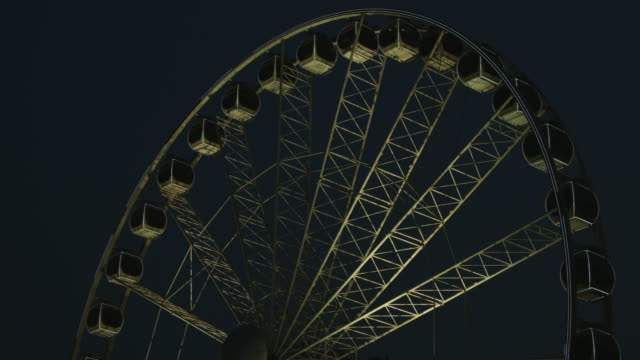 Locked-on-shot-of-Ferris-wheel-at-night