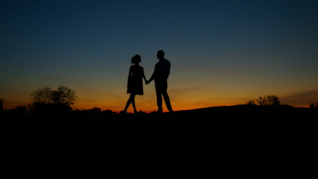 Lovers-on-sunset-background.