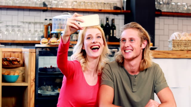 Smiling-couple-taking-a-selfie