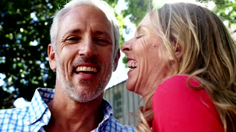 Mature-couple-is-embracing-and-laughing-in-the-street